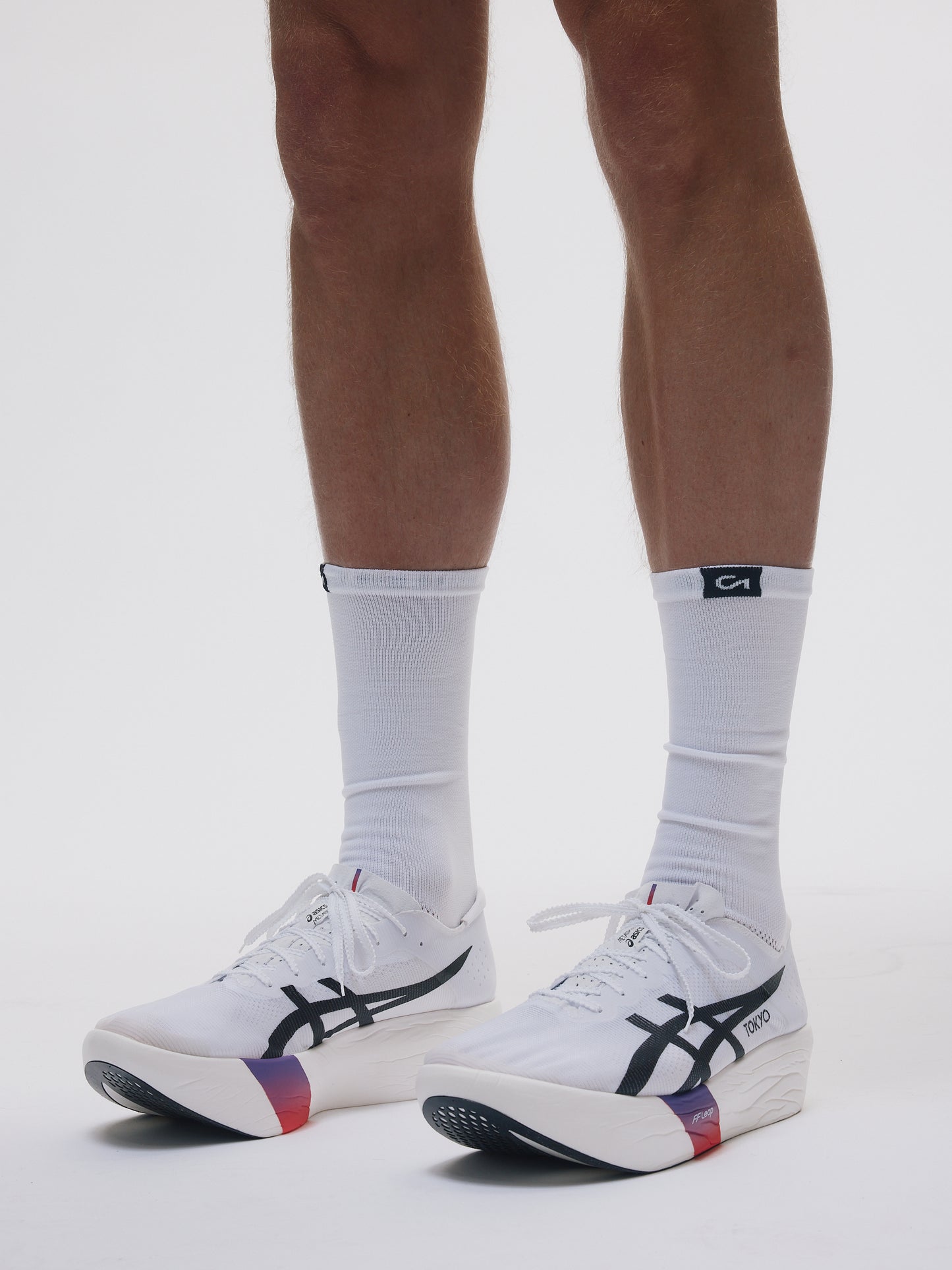 Renna Performance Running Socks worn by athlete, lacing into shoes