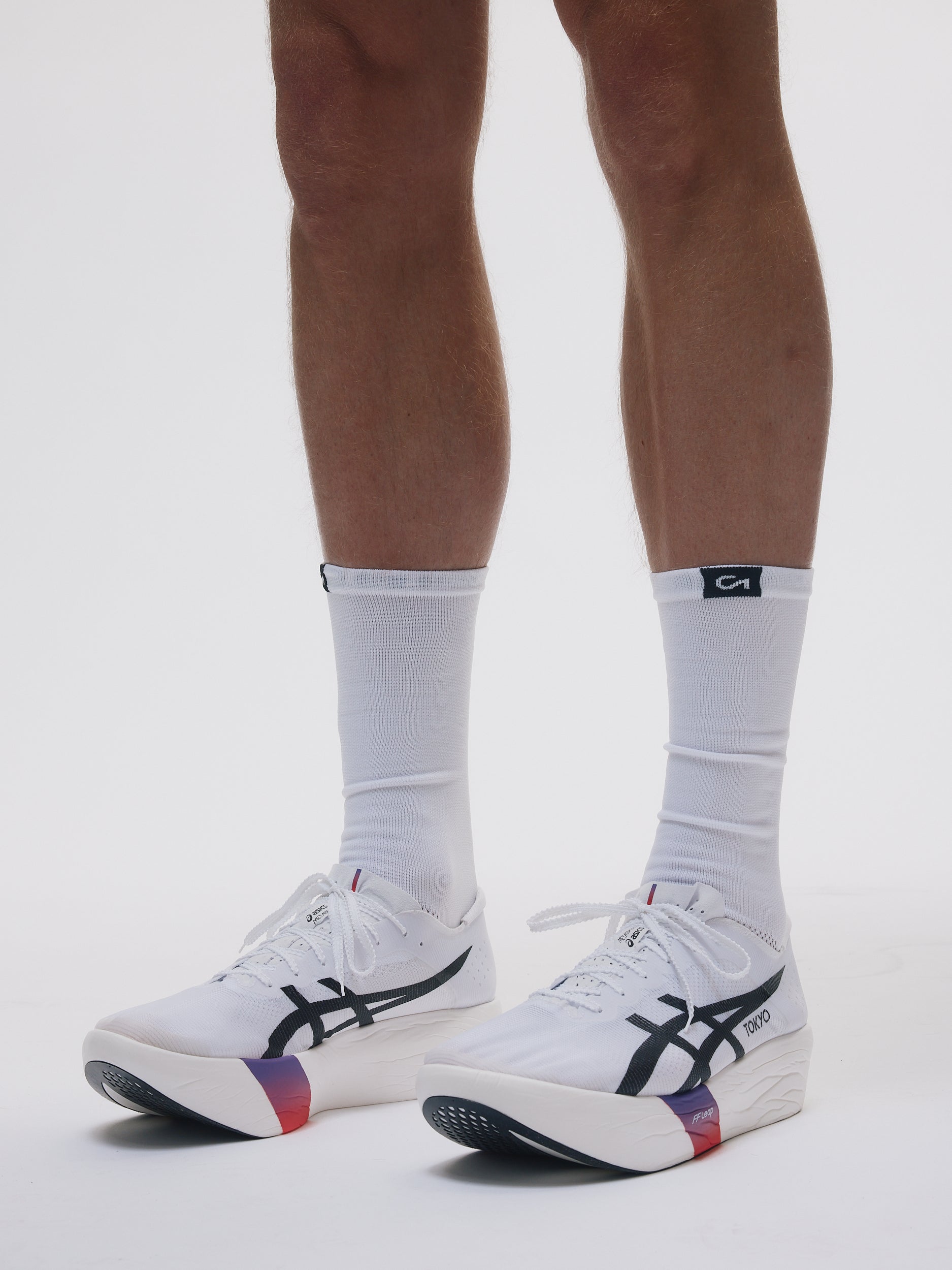 Renna Performance Running Socks worn by athlete, lacing into shoes
